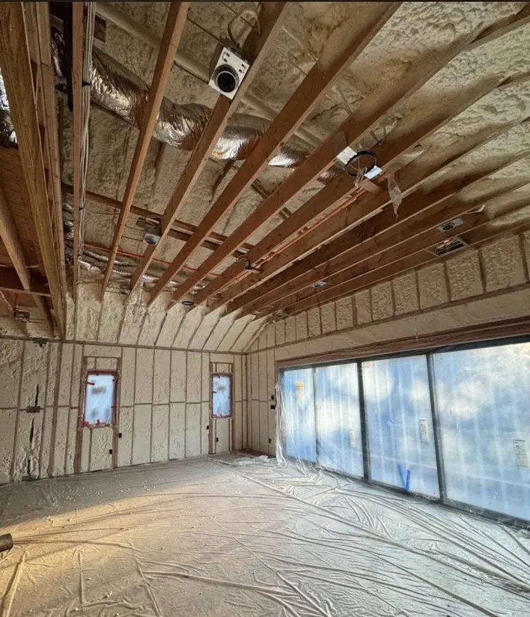 Interior walls and ceiling insulated with spray foam during new construction in Paloma Creek South